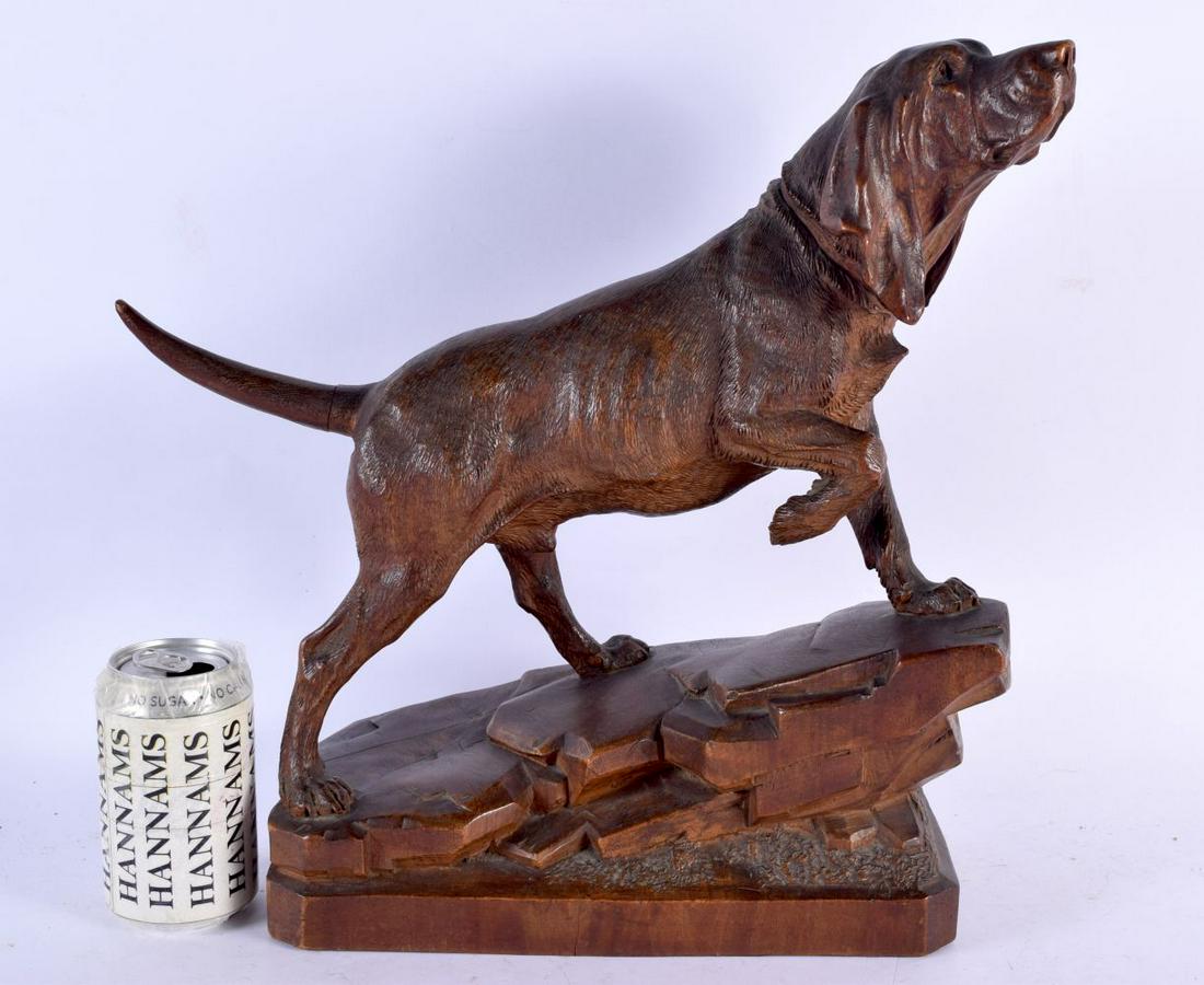 A VERY RARE 19TH CENTURY BAVARIAN BLACK FOREST CARVED WOOD HUNTING DOG modelled upon a naturalistic (1 of 6)