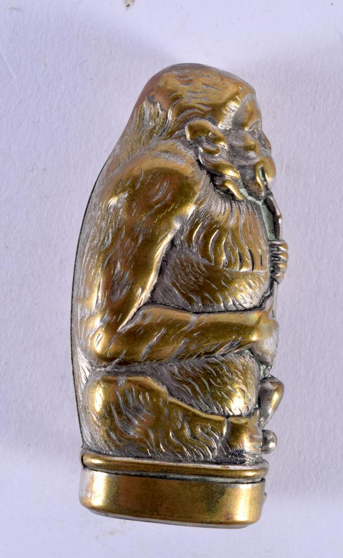 A VICTORIAN BRASS SMOKING APE VESTA CASE. 7 cm x 3 cm. (1 of 5)