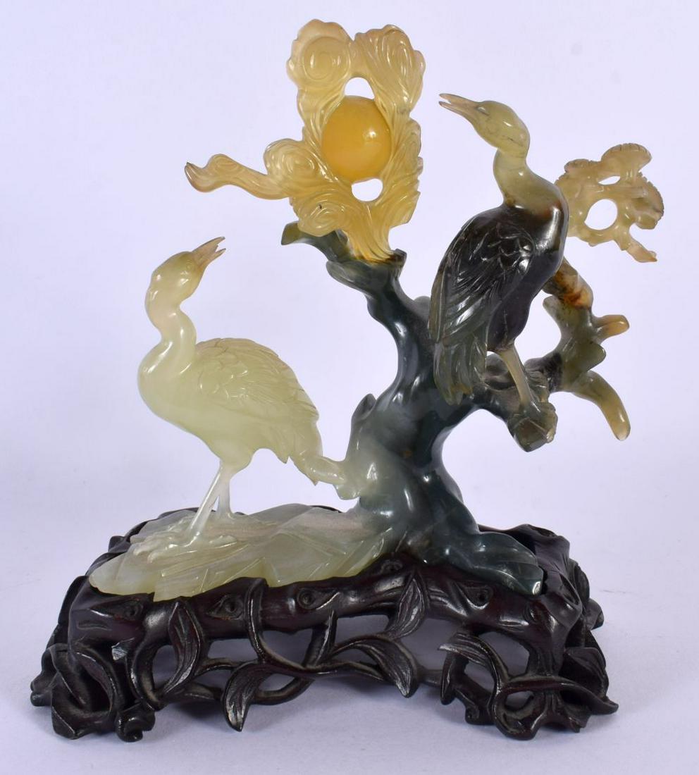 AN EARLY 20TH CENTURY CHINESE CARVED JADE FIGURAL GROUP Late Qing/Republic, depicting birds amongst (1 of 4)