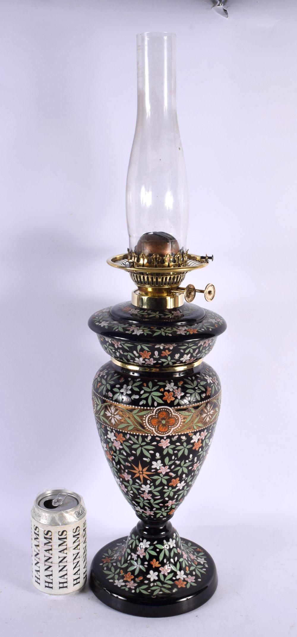 A LARGE VICTORIAN ENAMELLED GLASS OIL LANTERN painted all over with flowers and vines. 60 cm x 13 cm: A LARGE VICTORIAN ENAMELLED GLASS OIL LANTERN painted all over with flowers and vines. 60 cm x 13 cm.
