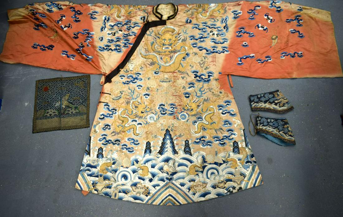 A LARGE 19TH CENTURY CHINESE ORANGE SILK WORK EMBROIDERED DRAGON ROBE together with a rank badge and (1 of 17)