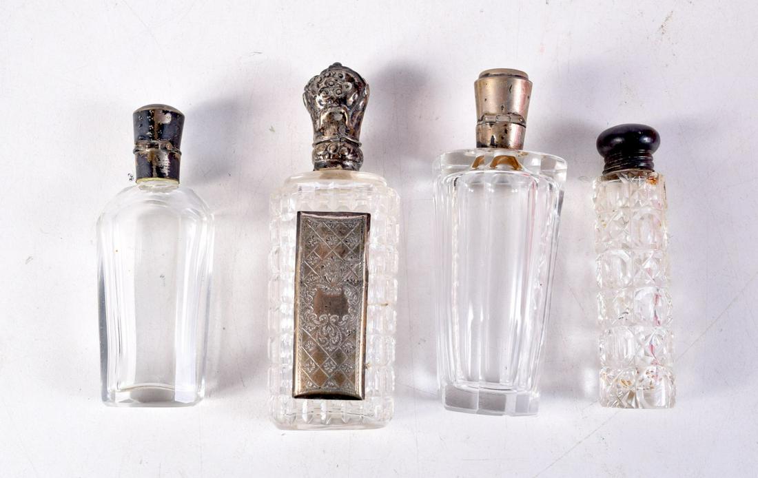 FOUR ANTIQUE SILVER TOPPED SCENT BOTTLES. Largest 9 cm x 3 cm. (4) (1 of 2)