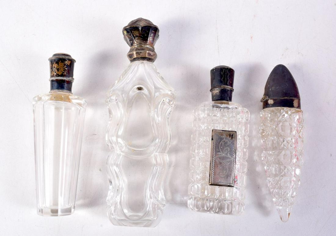 FOUR ANTIQUE SILVER TOPPED SCENT BOTTLES. Largest 12 cm x 3 cm. (4) (1 of 2)