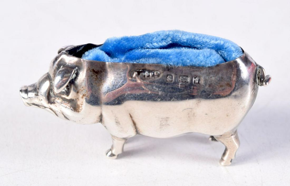 AN EDWARDIAN SILVER PIG PIN CUSHION. 7.2 grams. Birmingham 1905. 4.75 cm x 2.5 cm. (1 of 2)