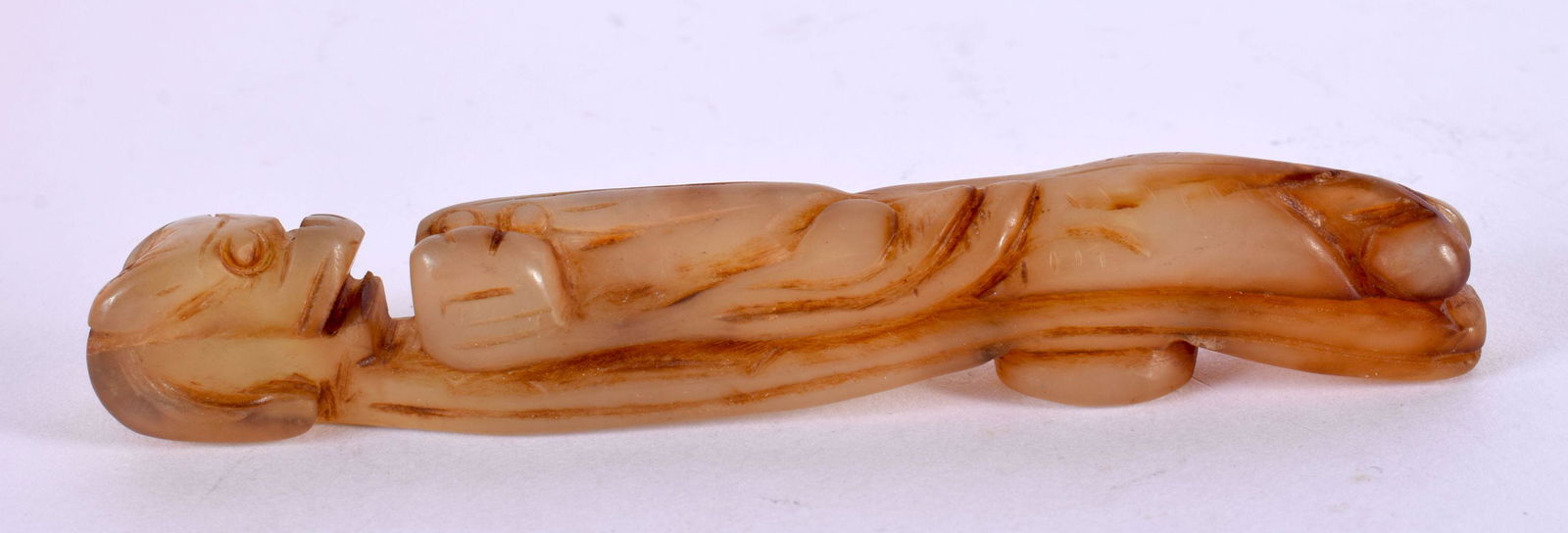 A CHINESE CARVED GREEN JADE BELT HOOK 20th Century. 11 cm long. (1 of 4)