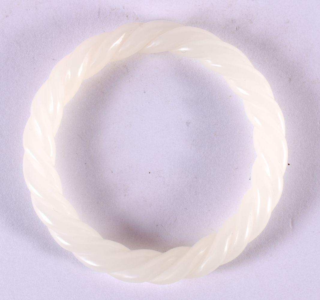 A CHINESE WHITE JADE TWIST BANGLE 20th Century. 8 cm diameter. (1 of 2)