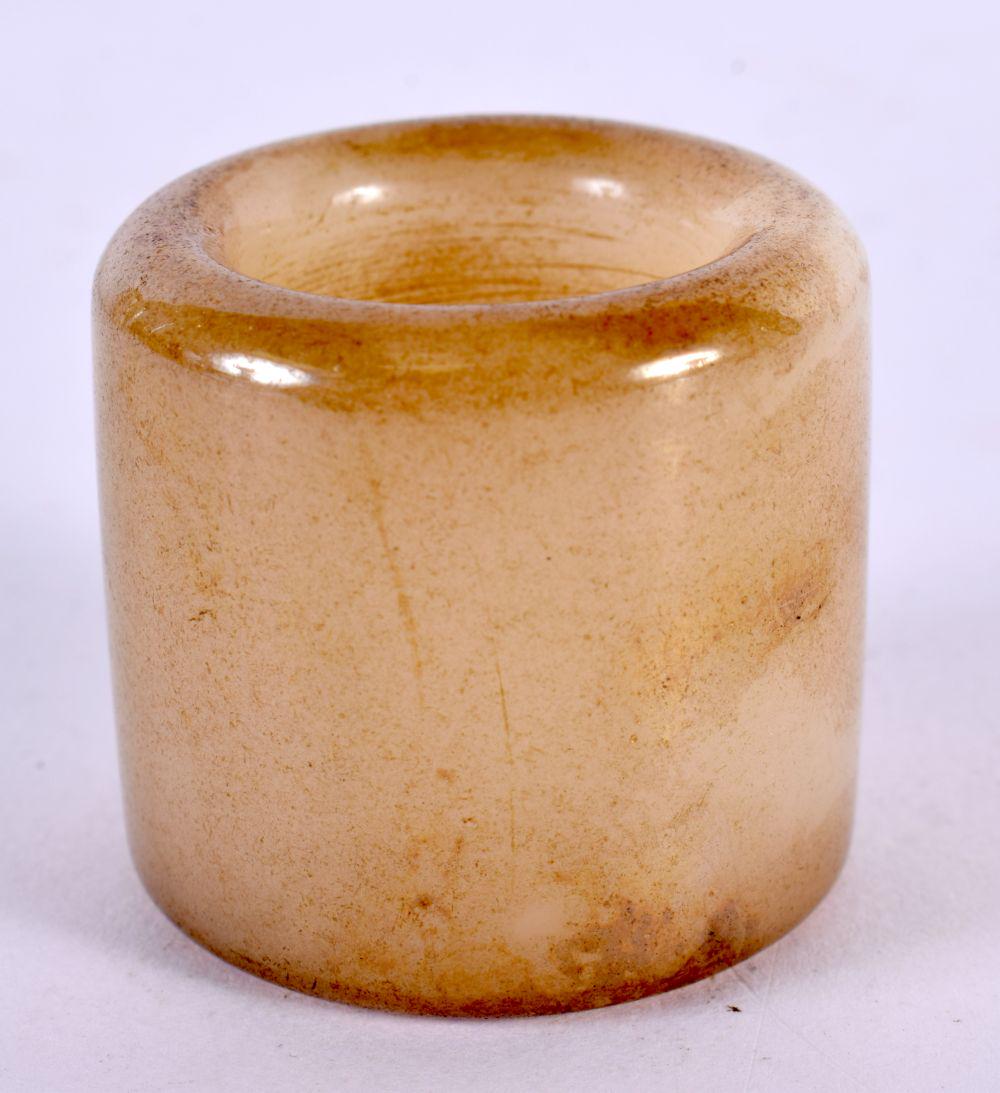 A CHINESE CARVED JADE ARCHERS RING 20th Century. 4 cm wide. (1 of 3)