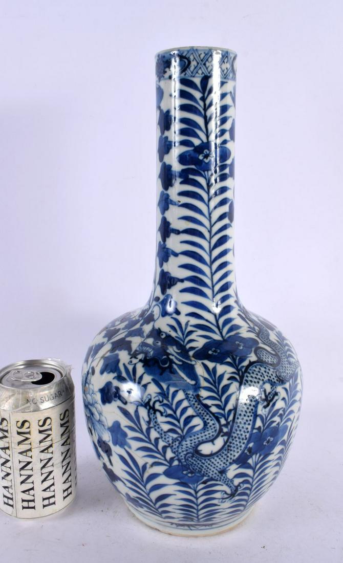 A LARGE 19TH CENTURY CHINESE BLUE AND WHITE PORCELAIN DRAGON VASE bearing Kangxi marks to base. 36 c: A LARGE 19TH CENTURY CHINESE BLUE AND WHITE PORCELAIN DRAGON VASE bearing Kangxi marks to base. 36 cm x 14 cm.