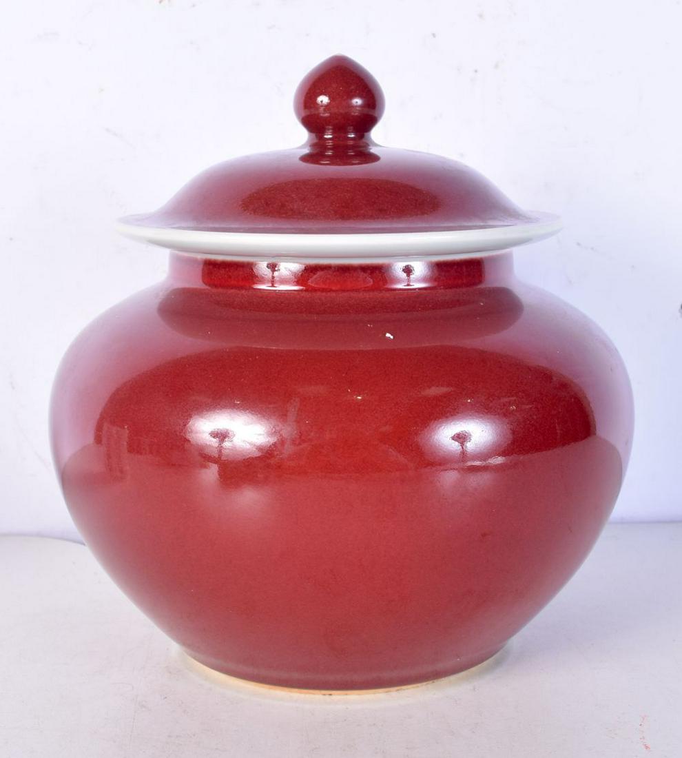 A Chinese Sang de boeuf porcelain jar and cover bearing Xuande marks. 22 cm x 20 cm.: A Chinese Sang de boeuf porcelain jar and cover bearing Xuande marks. 22 cm x 20 cm.