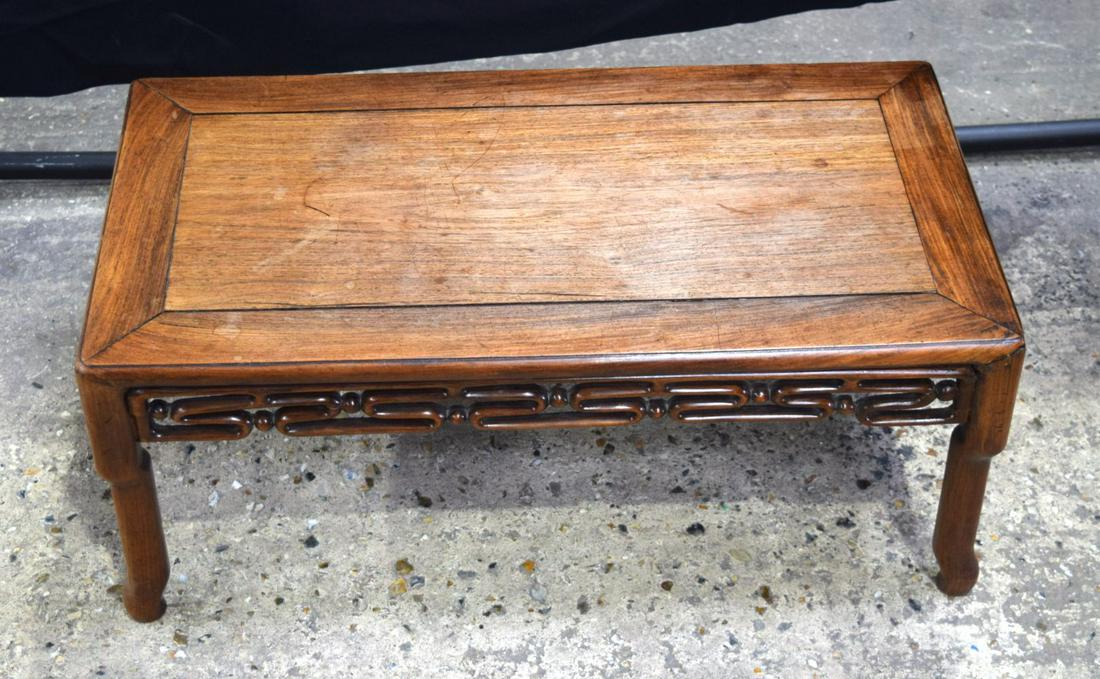A small Chinese hardwood opium table 32 x 76 cm. (1 of 4)