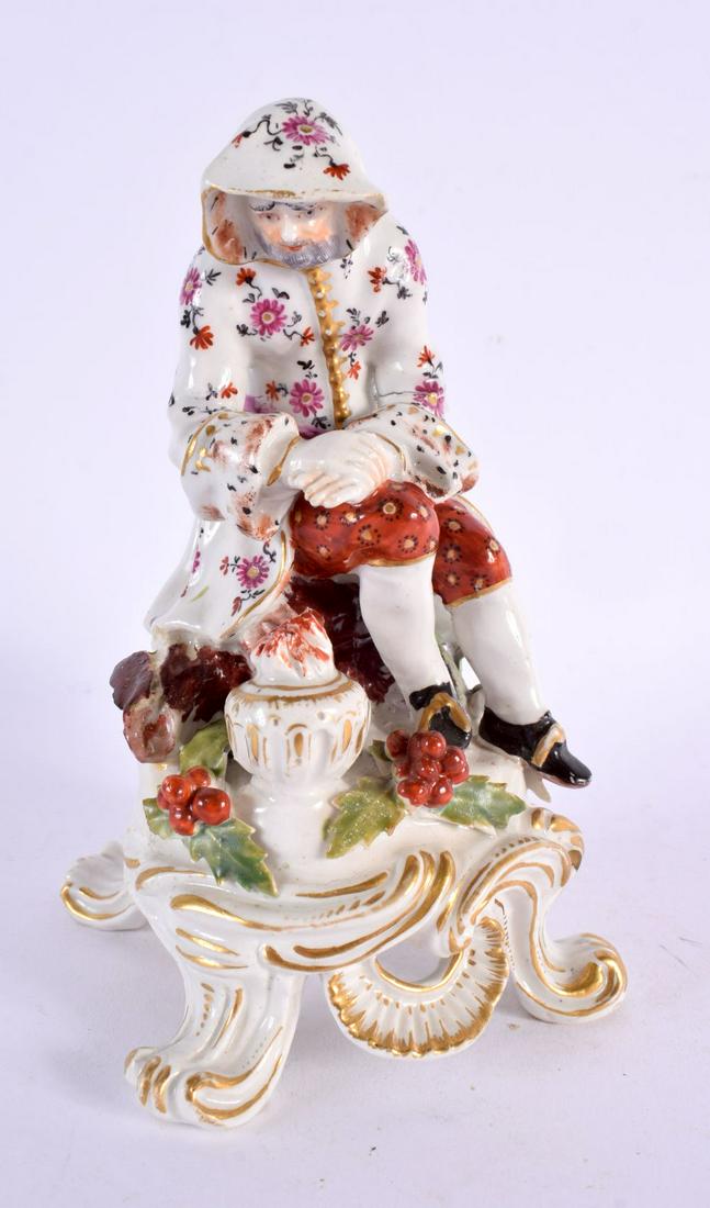 18th century Bow figure of Winter seated on a scroll base. 16.5cm high.: 18th century Bow figure of Winter seated on a scroll base. 16.5cm high.