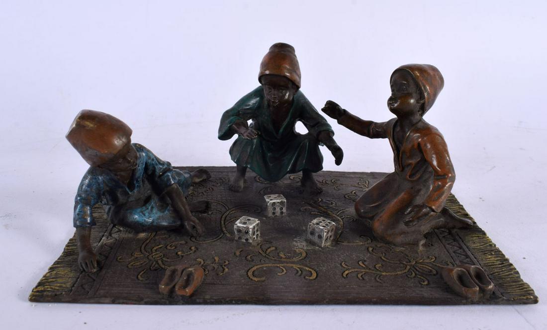 A CONTEMPORARY COLD PAINTED BRONZE FIGURAL GROUP depicting children playing dice. 20 cm x 14 cm. (1 of 5)