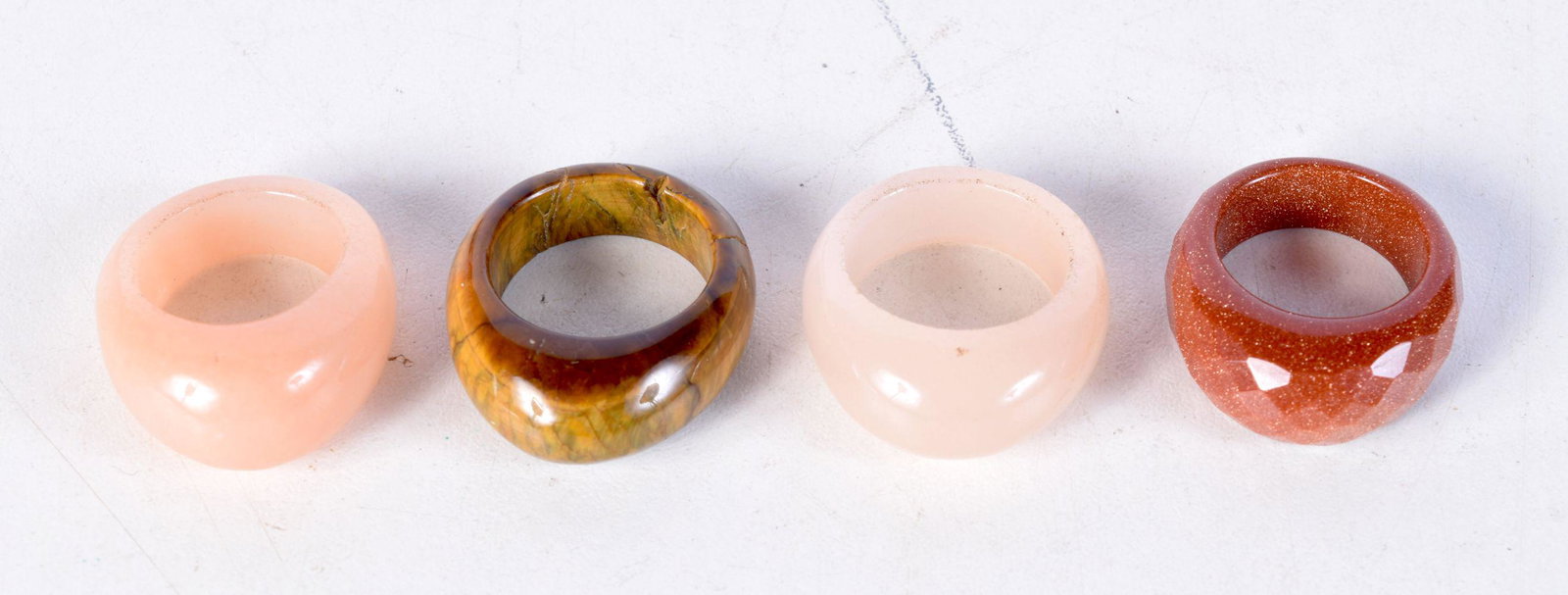 FOUR CHINESE HARDSTONE RINGS. N, P & S. 31.5 grams. (4) (1 of 3)