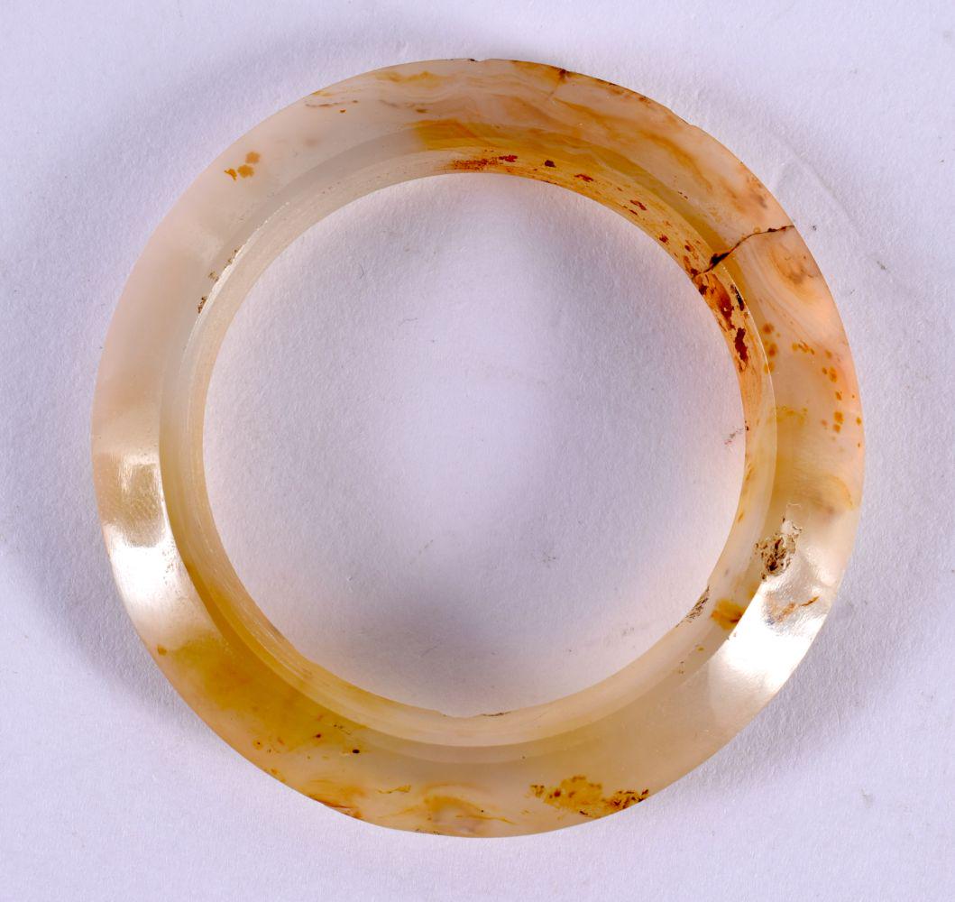 AN EARLY CHINESE CARVED ARCHAIC AGATE CIRCULAR BI DISC. 5.5 cm wide. (1 of 5)