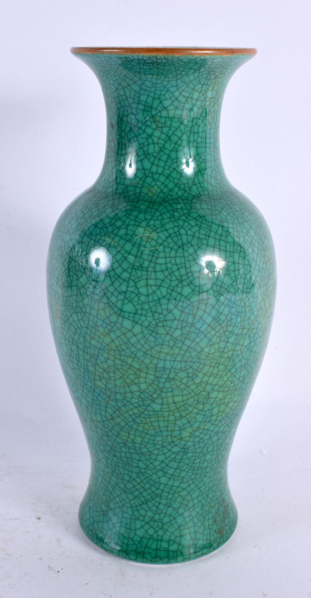 A CHINESE QING DYNASTY MONOCHROME CRACKLE GLAZED VASE of baluster form. 21 cm high. (1 of 4)