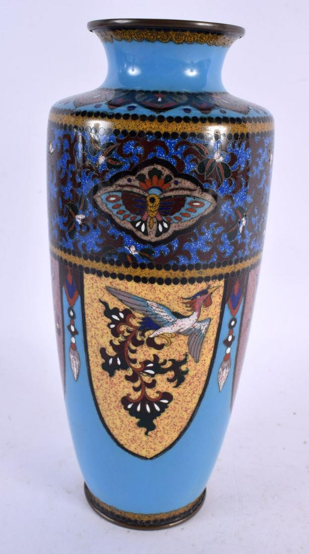 A LATE 19TH CENTURY JAPANESE MEIJI PERIOD CLOSIONNE ENAMEL VASE decorated with birds and foliage. 21: A LATE 19TH CENTURY JAPANESE MEIJI PERIOD CLOSIONNE ENAMEL VASE decorated with birds and foliage. 21 cm x 8 cm.