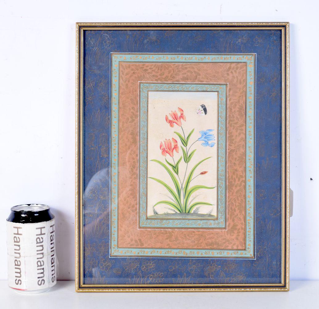 A framed Indian Mughal watercolour depicting flowers. 28 x 20cm.: A framed Indian Mughal watercolour depicting flowers. 28 x 20cm.