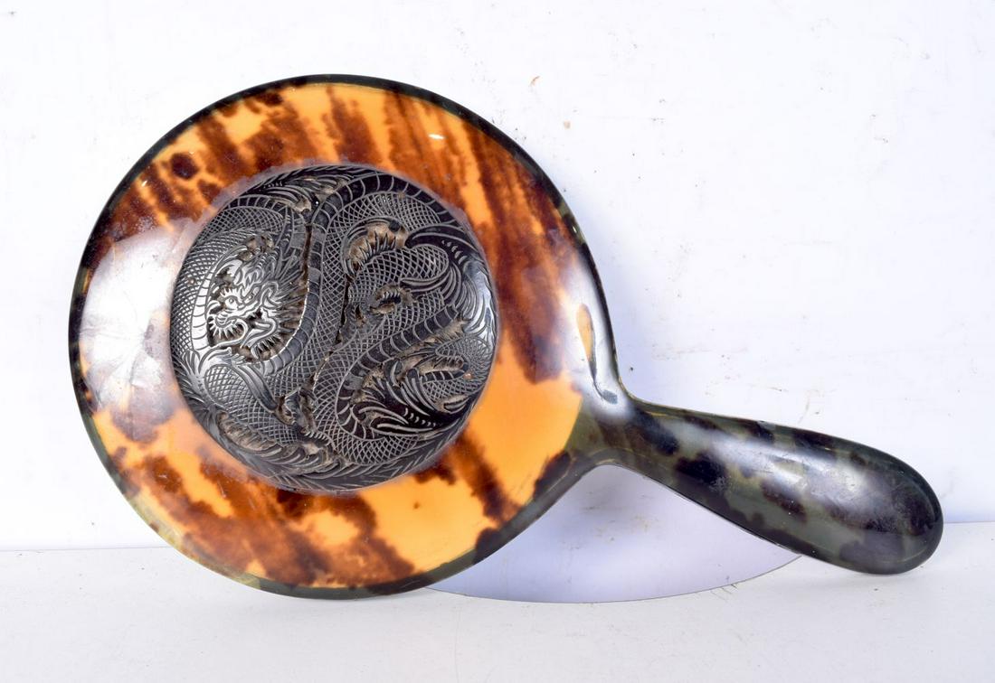A Chinese Tortoiseshell mirror with a lacquered dragon carving. 27 x 16cm. (1 of 2)