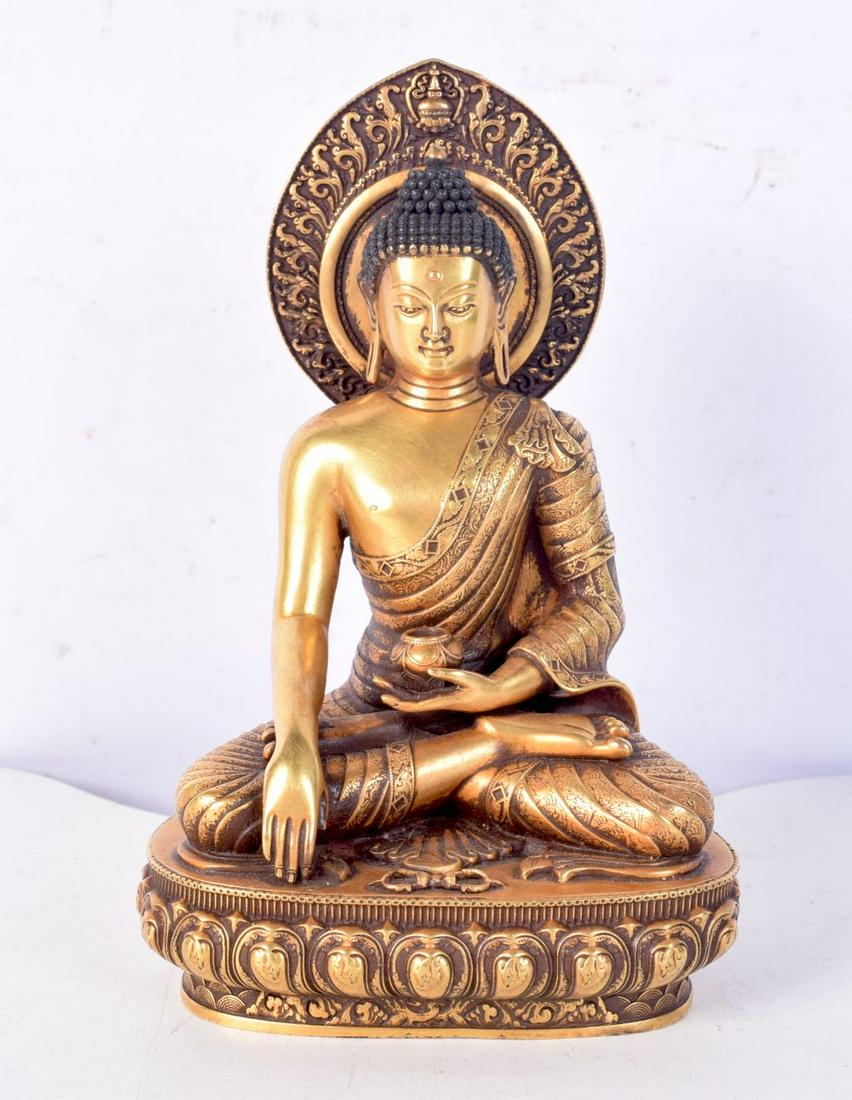 A Tibetan gilt bronze Buddha. 17cm.: A Tibetan gilt bronze Buddha. 17cm.
