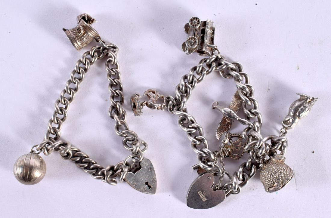 TWO HALLMARKED SILVER CHARM BRACELETS WITH 8 CHARMS. Total weight 78g: TWO HALLMARKED SILVER CHARM BRACELETS WITH 8 CHARMS. Total weight 78g
