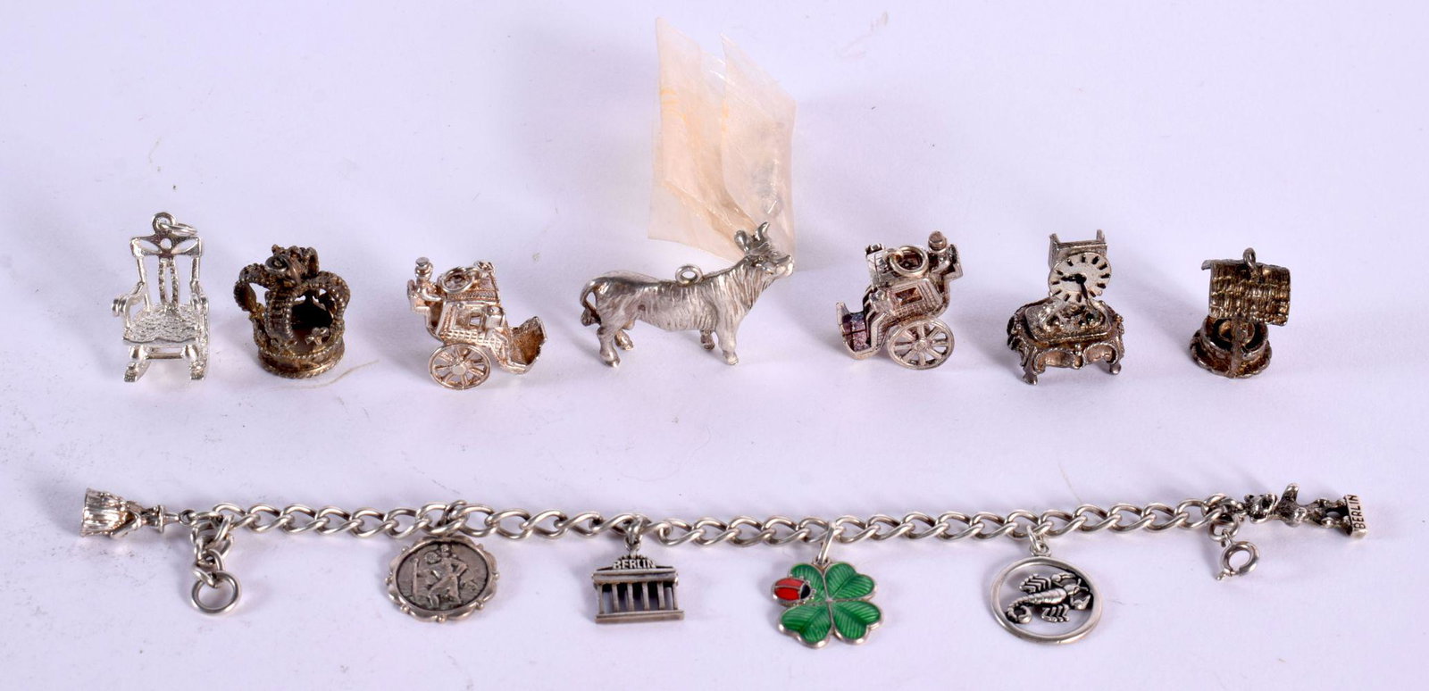A SILVER CHARM BRACELET WITH 6 SMALL CHARMS TOGETHER WITH 8 LARGER SILVER CHARMS. Bracelet length 17 (1 of 2)