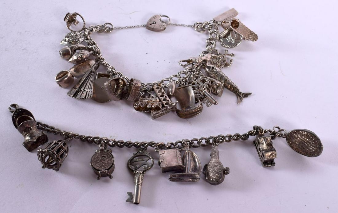 2 SILVER CHARM BRACELETS - 1 WITH 9 CHARMS THE OTHER WITH 22 CHARMS. Total weight 130g (2) (1 of 3)
