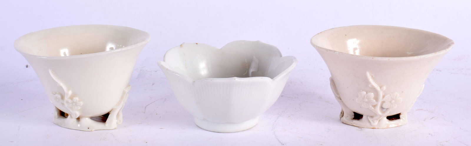 A PAIR OF 18TH CENTURY CHINESE BLANC DE CHINE PORCELAIN LIBATION CUPS Qing, together with a late 19t (1 of 4)