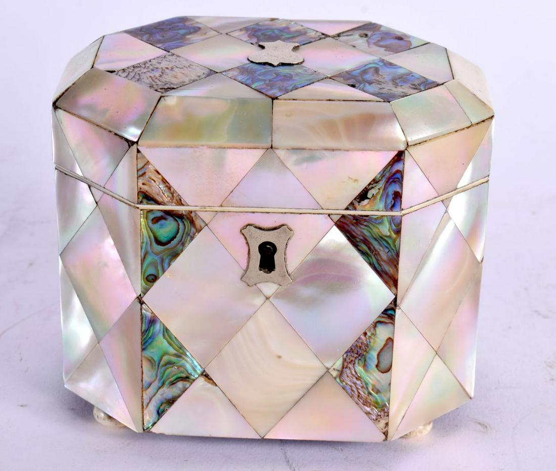 A LATE REGENCY CARVED MOTHER OF PEARL AND ABALONE SHELL TEA CADDY of octagonal form with white metal (1 of 4)