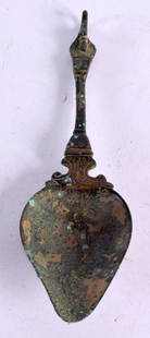 A 12TH/13TH CENTURY MIDDLE EASTERN BRONZE SWAN HEAD SPOON of slender for, with open stem leading to: A 12TH/13TH CENTURY MIDDLE EASTERN BRONZE SWAN HEAD SPOON of slender for, with open stem leading to a tapered bowl. 18 cm long. Note: The design may be loosely based upon Hellenistic spoons Circa 2nd-