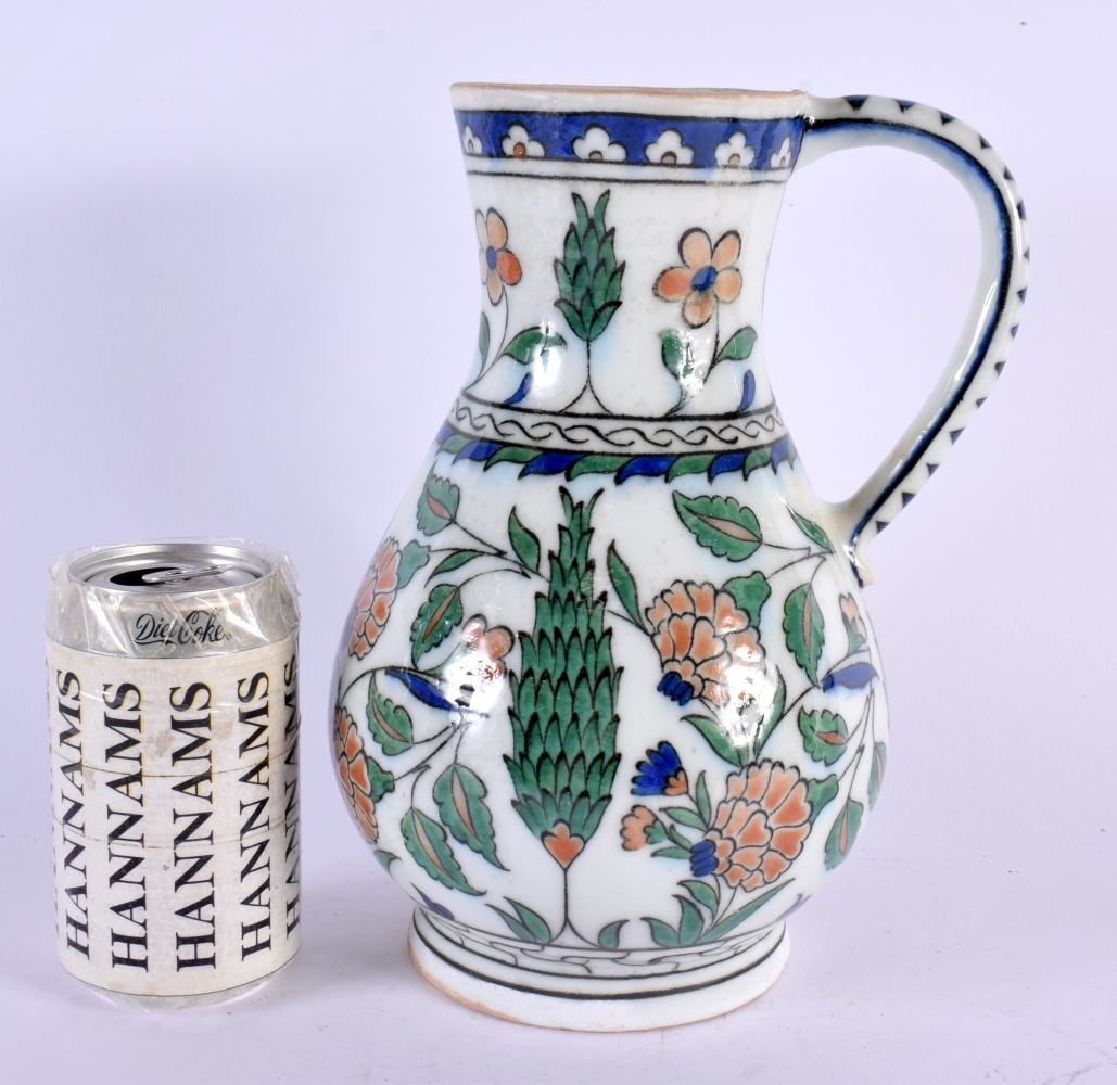 A LARGE TURKISH OTTOMAN MIDDLE EASTERN IZNIK TYPE JUG painted with flowers. 26 cm x 12 cm. (1 of 6)