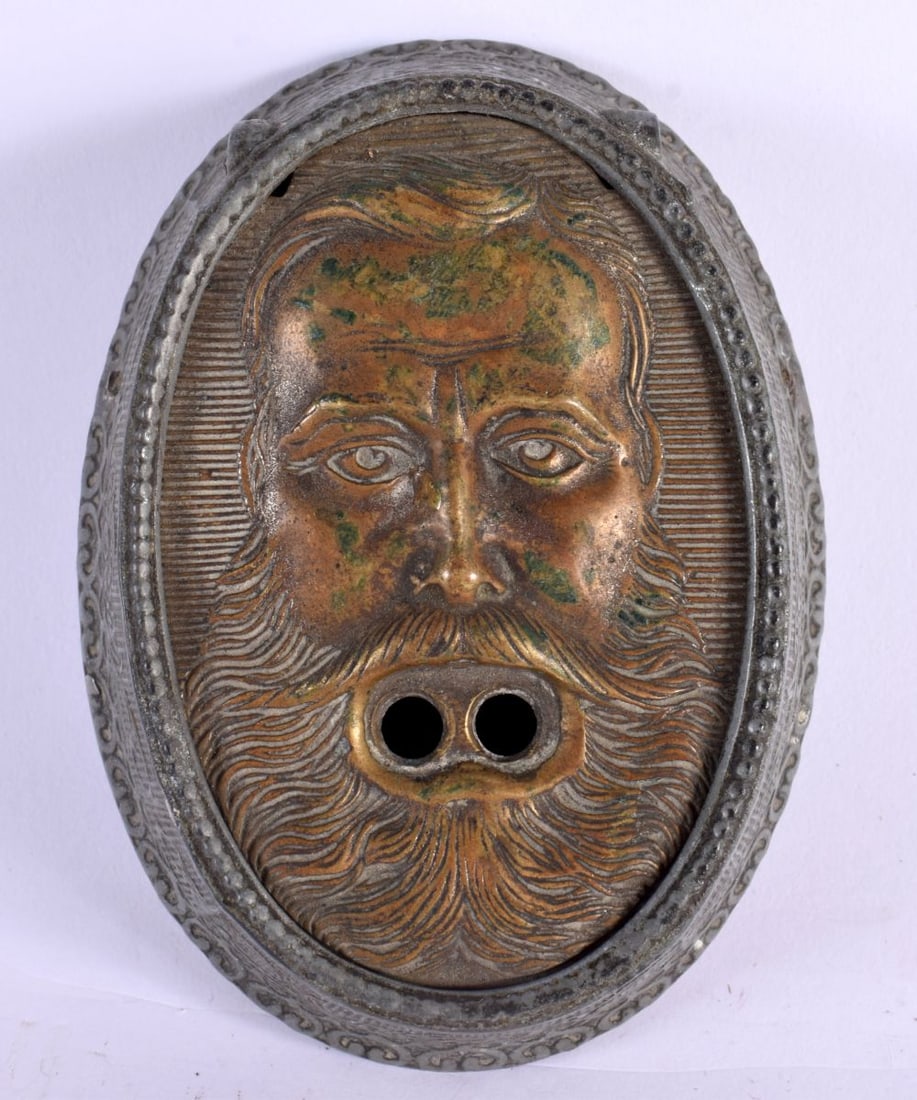 A VERY RARE ANTIQUE MIXED METAL MASK HEAD CHEROOT CIGAR CUTTER unusually formed as an oval with flat (1 of 4)