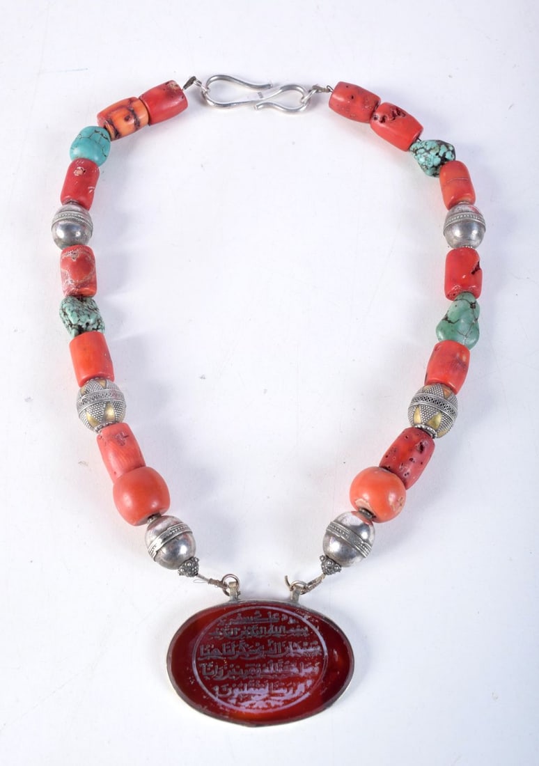 A MIDDLE EASTERN SILVER CORAL TURQUOISE AND AGATE NECKLACE carved with Islamic script. 56 cm long. (1 of 3)