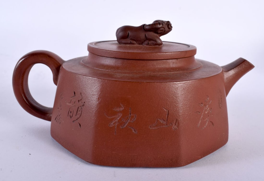 A CHINESE REPUBLICAN PERIOD YIXING TEAPOT AND COVER decorated with landscapes. 15 cm wide. (1 of 7)