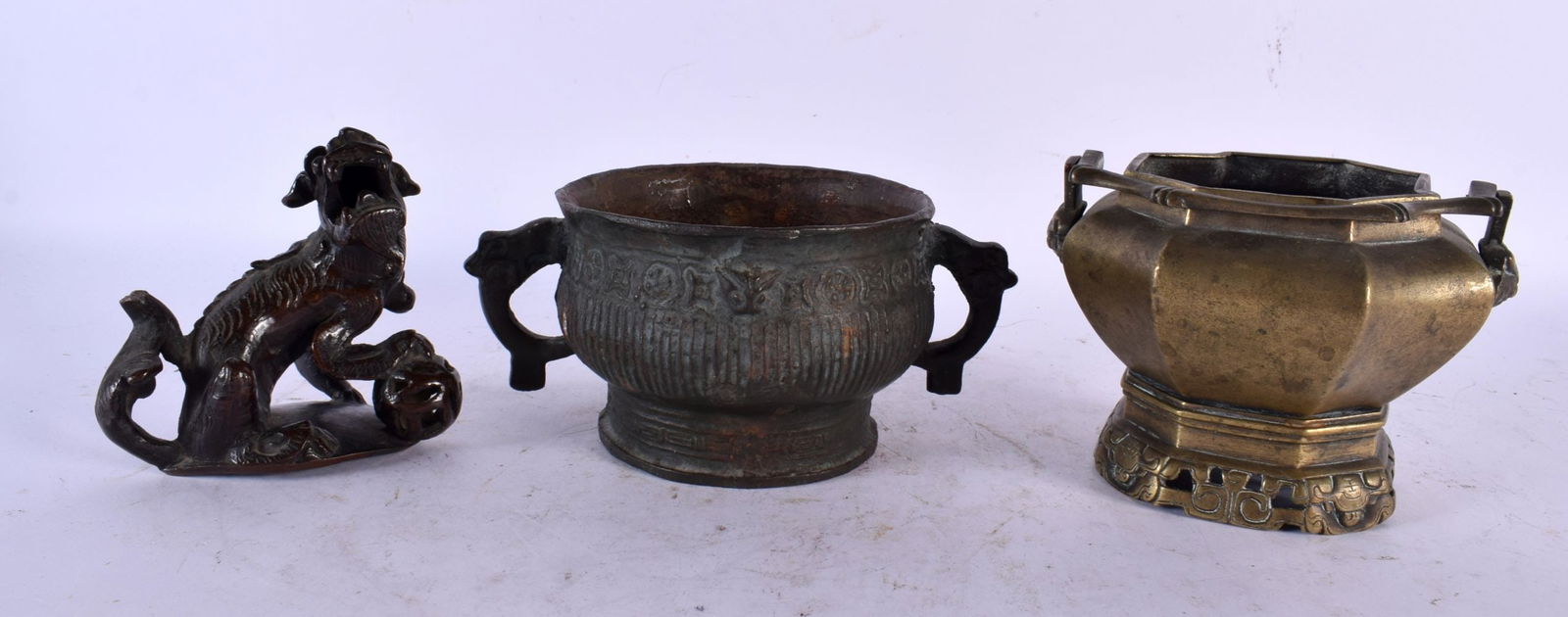 A 17TH/18TH CENTURY CHINESE BRONZE FIGURE OF A BUDDHISTIC LION Ming/Qing, together with two censers. (1 of 5)