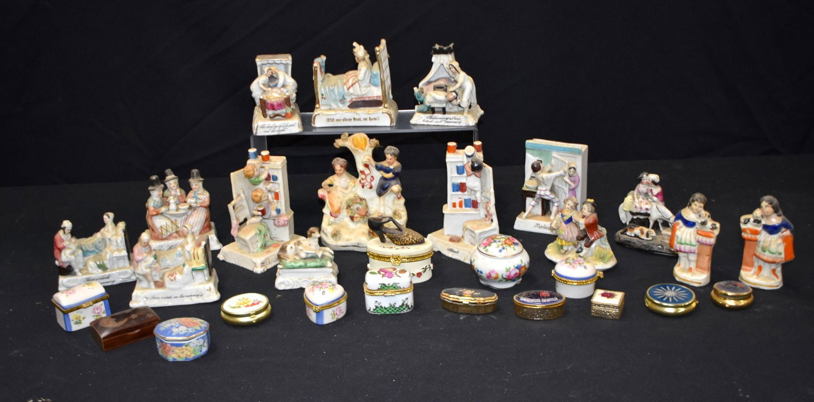 A collection of ceramic and enamelled metal English and Continental pill boxes and figures, together: A collection of ceramic and enamelled metal English and Continental pill boxes and figures, together with some small porcelain figures. Tallest 12cm (Qty).