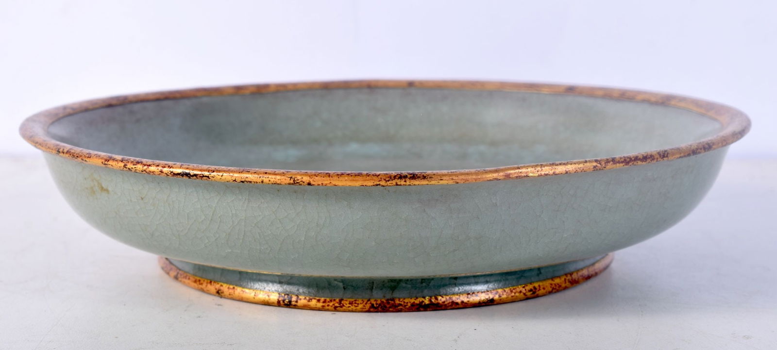 A Chinese porcelain Celadon dish with calligraphy to the base 4 x 19 cm .: A Chinese porcelain Celadon dish with calligraphy to the base 4 x 19 cm .