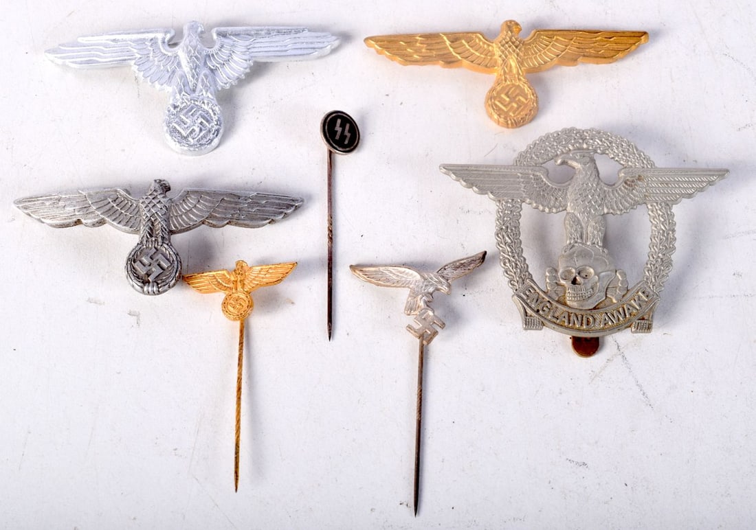 A collection of contemporary German WW2 military Cap Eagle,lapel pin etc (7). (1 of 5)