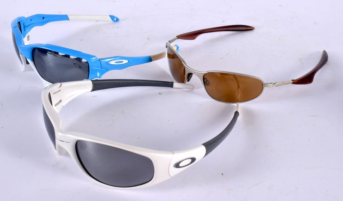 THREE PAIRS OF OAKLEY SUNGLASSES. (3) (1 of 2)