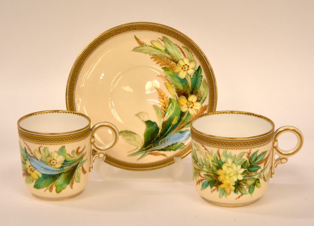 Royal Worcester coffee cup, teacup and saucer painted with primula by David Bates date mark for 1881: Royal Worcester coffee cup, teacup and saucer painted with primula by David Bates date mark for 1881. saucer 14cm wide