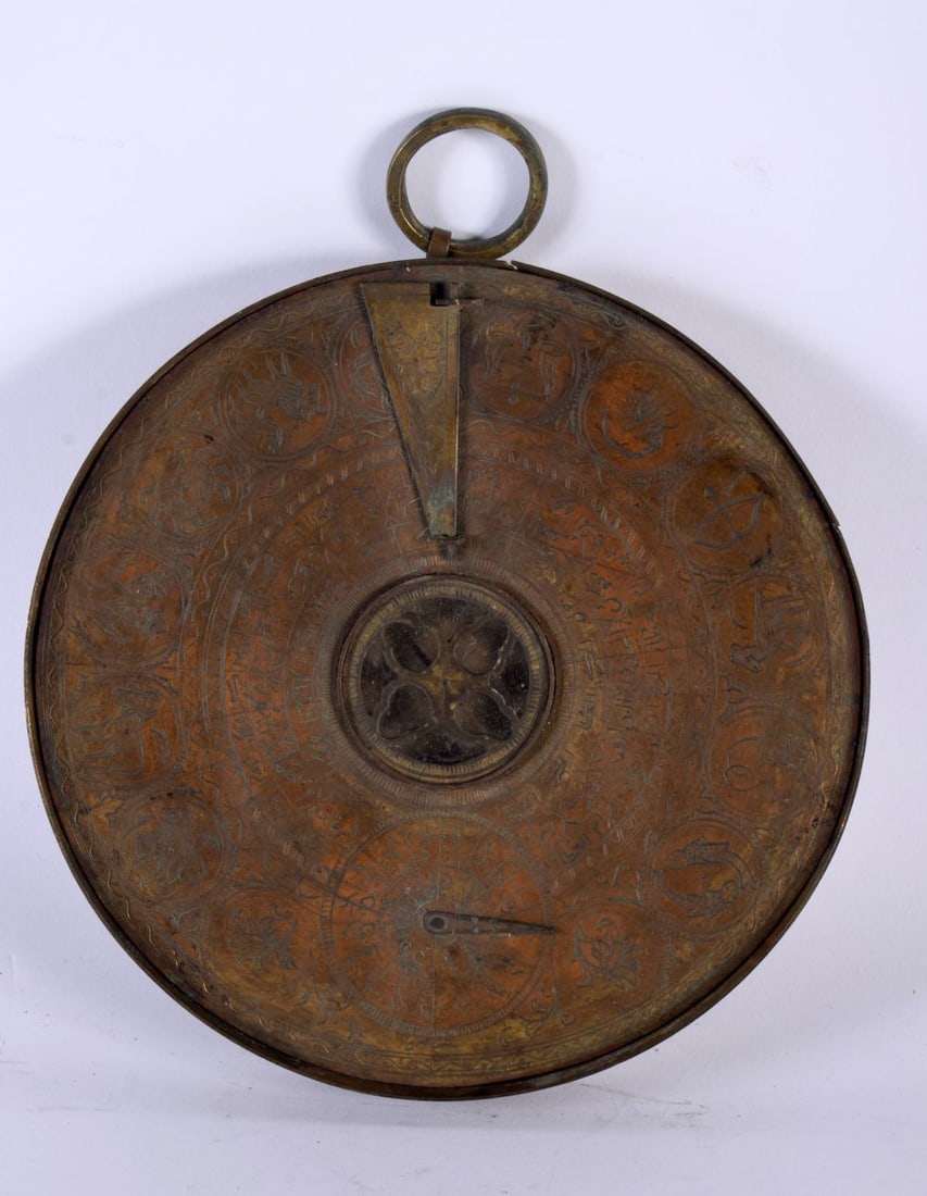 A 19TH CENTURY MIDDLE EASTERN ISLAMIC COPPER ALLOY ASTROLABE decorated all over with animals, script (1 of 10)