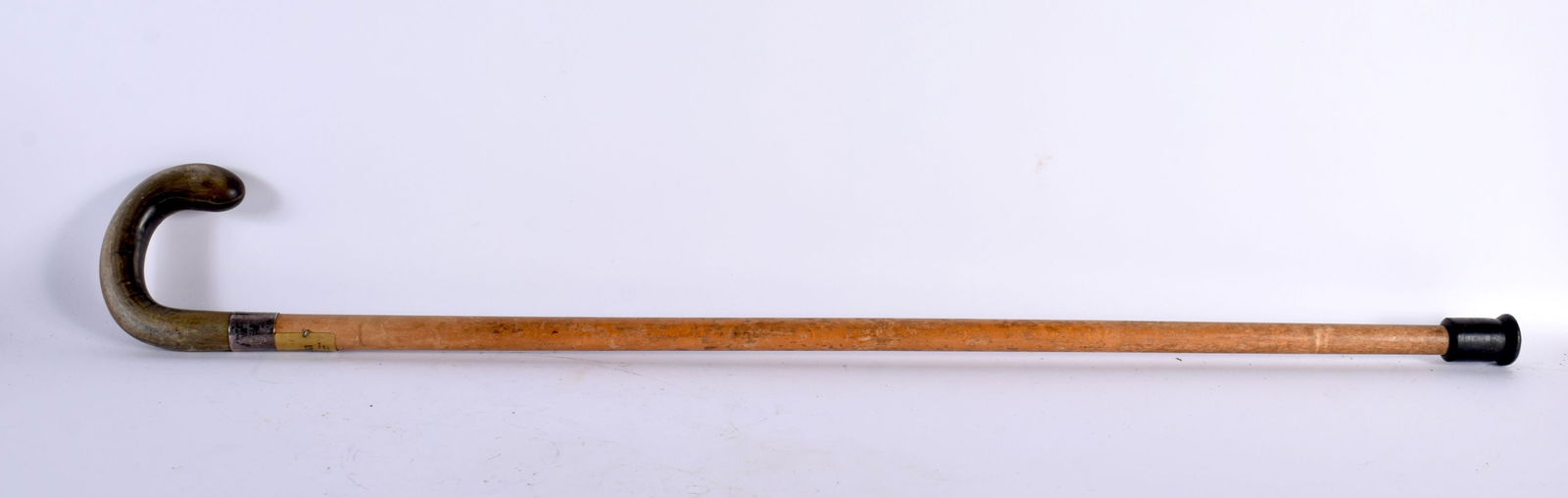 A 19TH CENTURY MIDDLE EASTERN CARVED RHINOCEROS HORN WALKING CANE with silver mounts. 90cm long. (1 of 3)