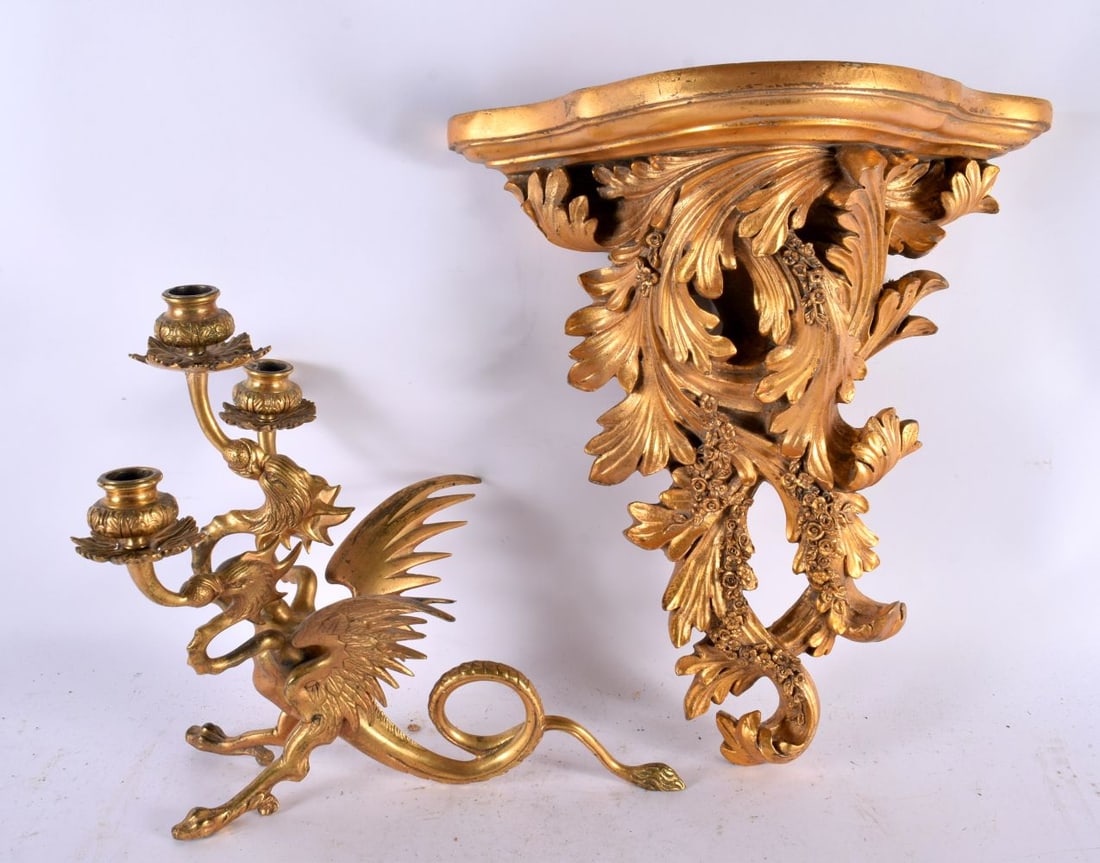 A 19TH CENTURY GILT BRONZE CANDELABRA in the form of a three headed griffin with wings of a phoenix, (1 of 7)