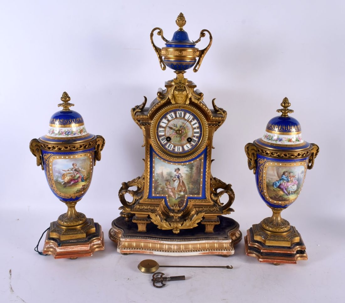 A LARGE 19TH CENTURY FRENCH SEVRES PORCELAIN CLOCK GARNITURE painted with figures within landscapes (1 of 7)