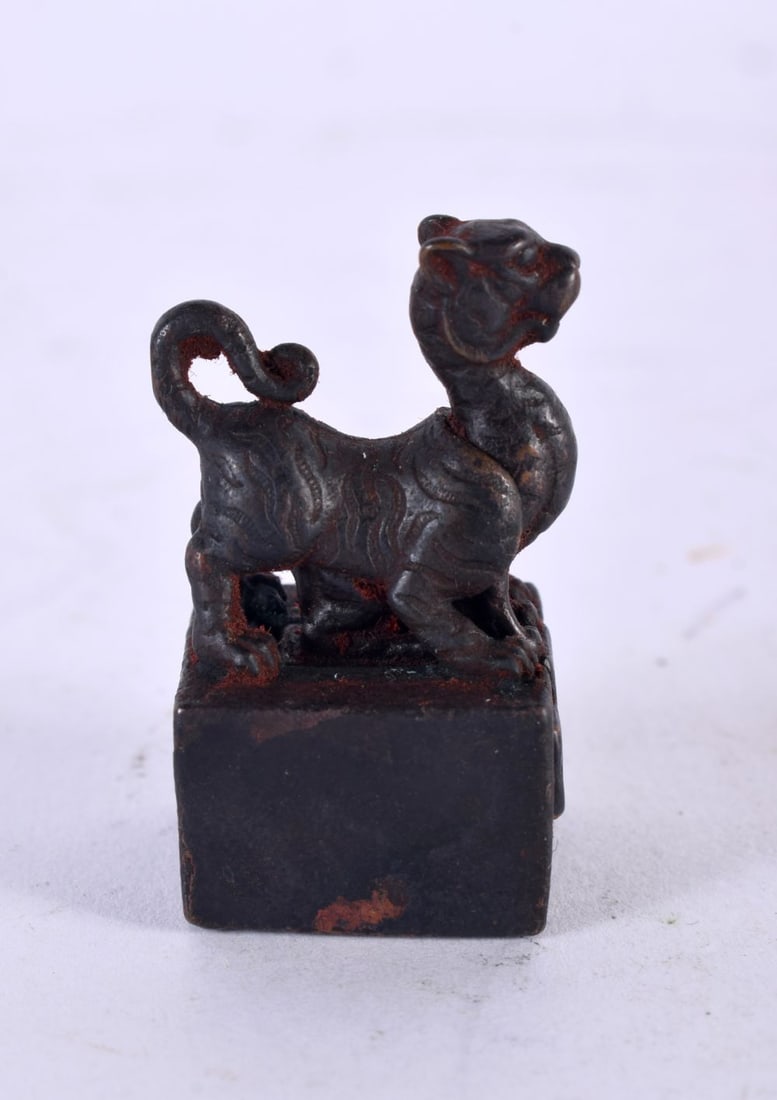 A CHINESE BRONZE BUDDHISTIC BEAST SEAL. 45 grams. 3.5 cm x 2 cm. (1 of 4)
