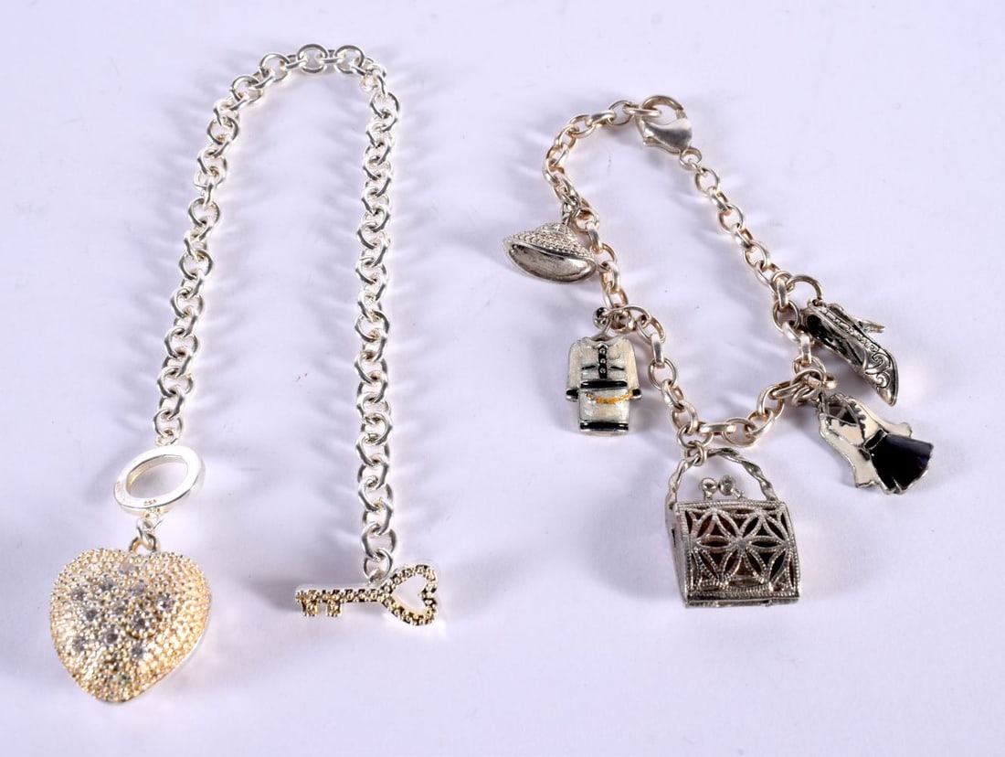 TWO SILVER CHARM BRACELETS. sTAMPED 925, lONGEST 20CM, TOTAL WEIGHT 43.8G (2): TWO SILVER CHARM BRACELETS. sTAMPED 925, lONGEST 20CM, TOTAL WEIGHT 43.8G (2)