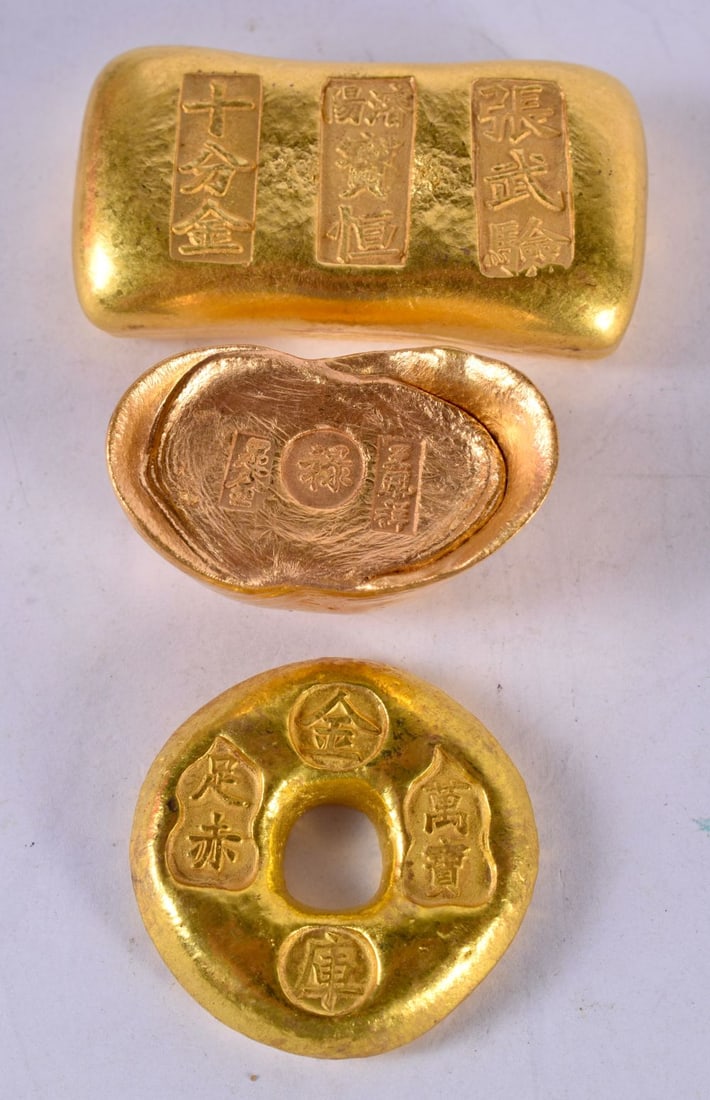 THREE CHINESE YELLOW METAL INGOTS. 336 grams. Largest 6 cm x 3.25 cm. (3) (1 of 3)