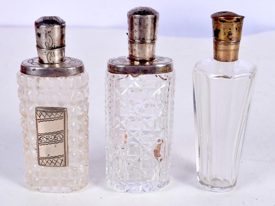 THREE SILVER MOUNTED SCENT BOTTLES.  Largest 8.8 cm x 3cm (3) (1 of 4)