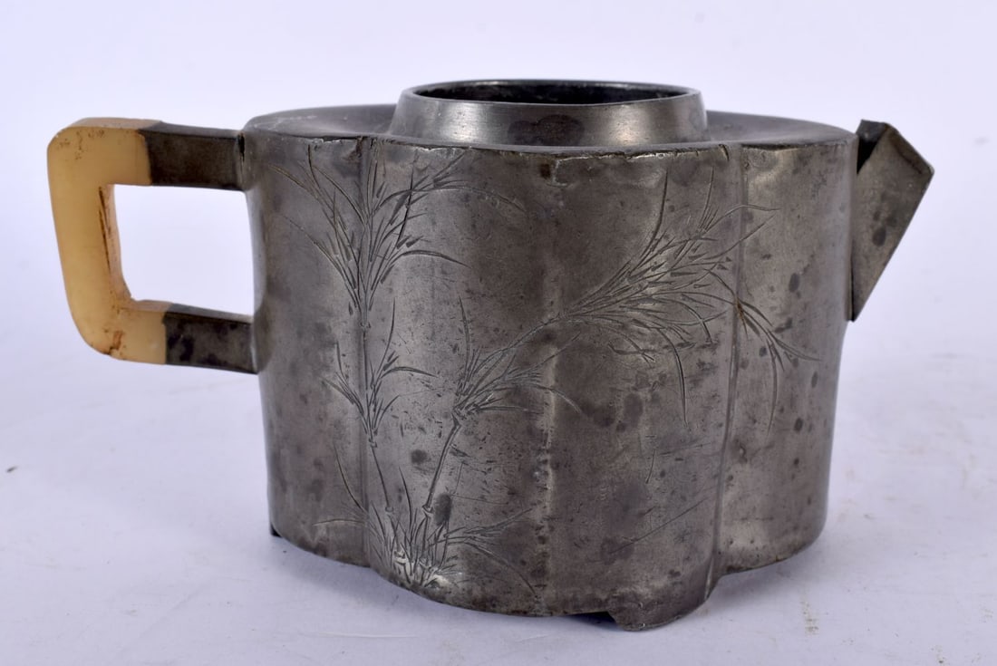 A 19TH CENTURY CHINESE PEWTER AND JADE YIXING POTTERY TEAPOT engraved with calligraphy. 15cm wide.: A 19TH CENTURY CHINESE PEWTER AND JADE YIXING POTTERY TEAPOT engraved with calligraphy. 15cm wide.