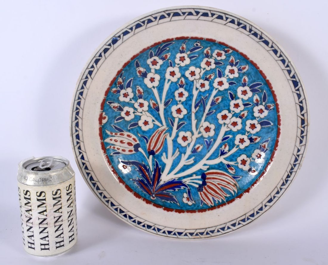 A LARGE TURKISH OTTOMAN IZNIK FAIENCE DISH painted with flowers. 30cm diameter. (1 of 5)