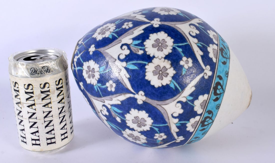 A LARGE TURKISH OTTOMAN KUTAHYA HANGING POTTERY MOSQUE BALL. 21 cm x 14cm.: A LARGE TURKISH OTTOMAN KUTAHYA HANGING POTTERY MOSQUE BALL. 21 cm x 14cm.